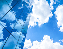 Clouds,Reflected,In,The,Many,Mirrored,Facets,Of,A,Modern